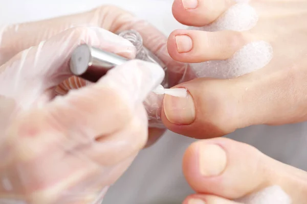 Painting nails at the feet. — Stock Photo, Image