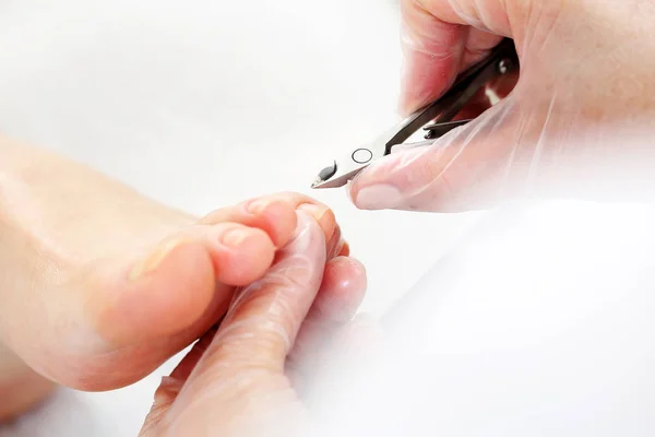 Pedicure, cutting skins. — Stock Image Pedicure, cutting skins. Stock Photo