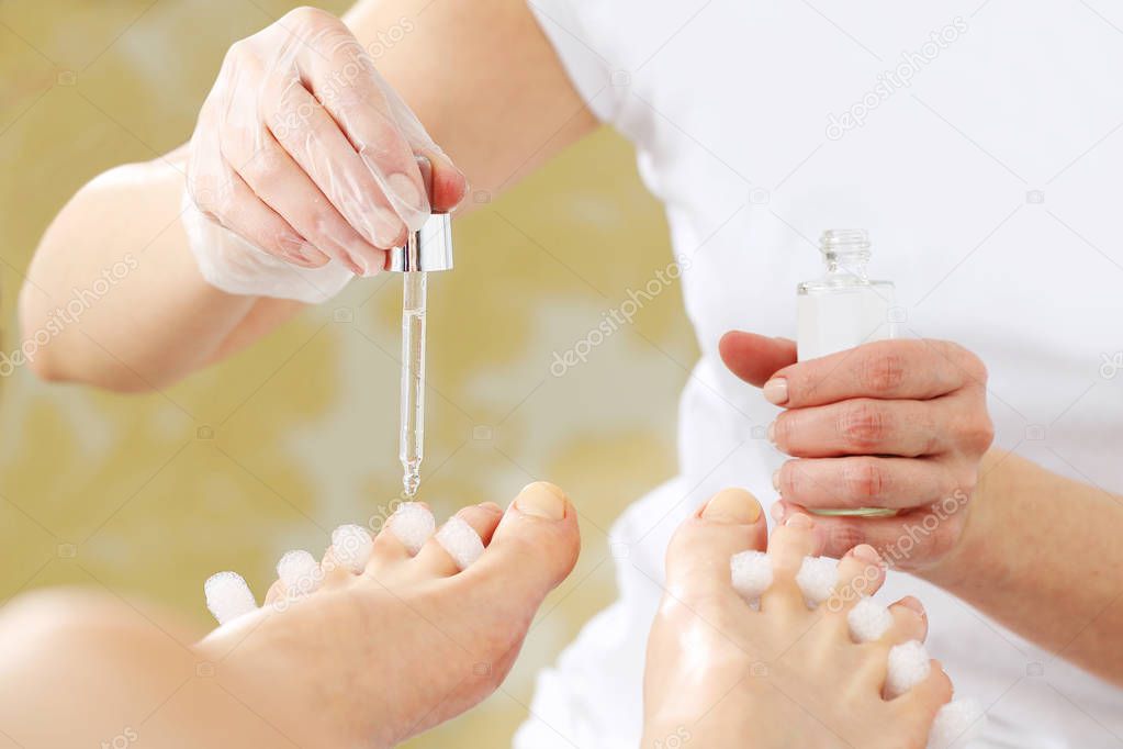Pedicure. Essential oil for skin care, beautiful feet.