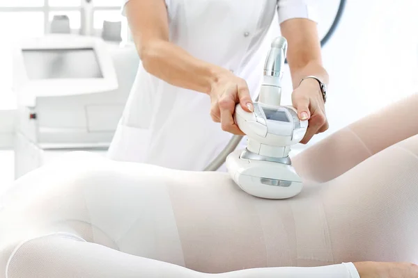 Vacuum massage. Endermology, abdominal vacuum massage. A woman's body during a care treatment — Stock Image Vacuum massage. Endermology, abdominal vacuum massage. A woman's body during a care treatment Royalty Free Stock Photos