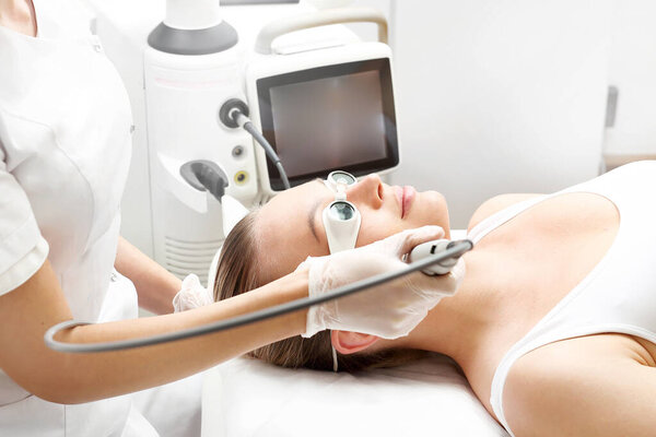 Laser wrinkle removal. Smooth, rejuvenated facial skin. Laser therapy