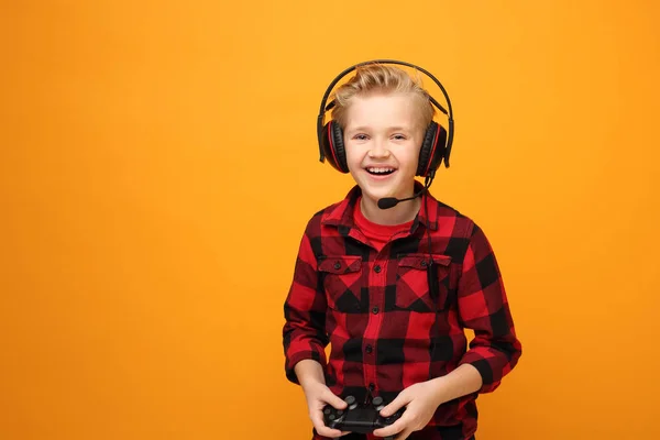 Young Boy Plays Console Headphones Young Handsome Smiling Caucasian Boy — Stock Photo, Image