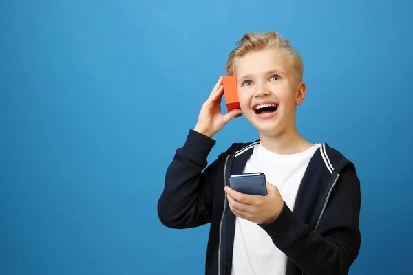 Boy Listens Music Loudspeaker Telephone Portrait Child Colored Blue Background — Stock Photo, Image