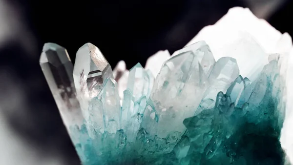 Texture of gemstone cluster closeup as a part of geode filled with rock blue Dumortierite Quartz crystals.