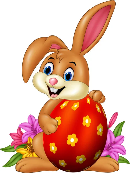 Kreslený zajíček drží velikonoční vejce — Stockový vektor