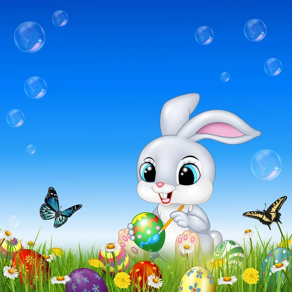 Conejo de dibujos animados decorando un huevo de Pascua — Vector de stock