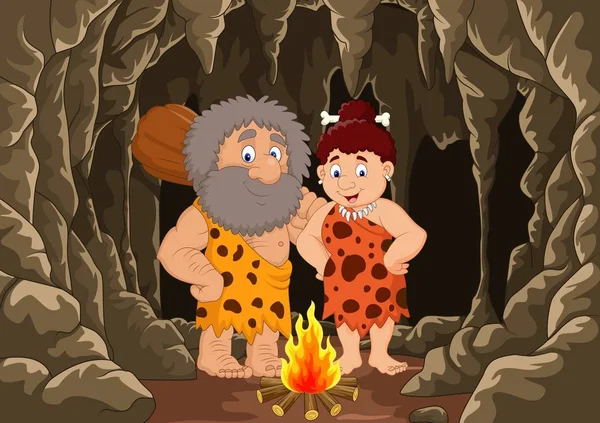 Cartoon prehistorische holbewoner paar met grot achtergrond — Stockvector