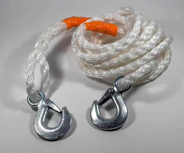 A tow rope with hooks on a light background. — Stock Photo, Image