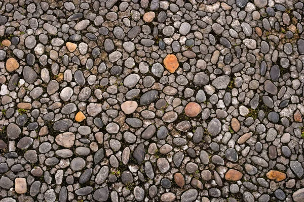 Road from cobblestone to stone texture or seamless background.