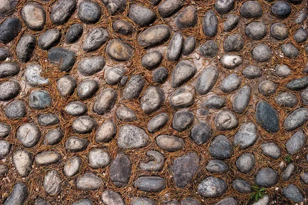 Road from cobblestone to stone texture or seamless background. — Stock Photo, Image