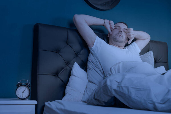 a man with sleep disorder wakes up in the night