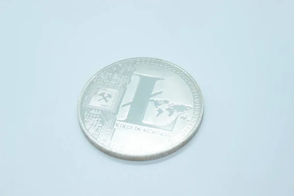 Physical silver litecoin coin is located on a white background — Stock Photo, Image