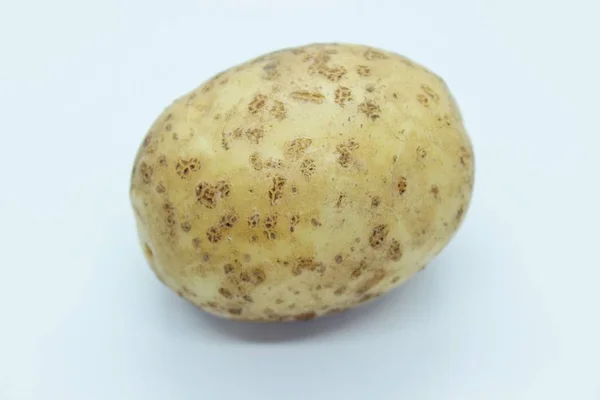 Potato tuber located on a white background — Stock Photo, Image