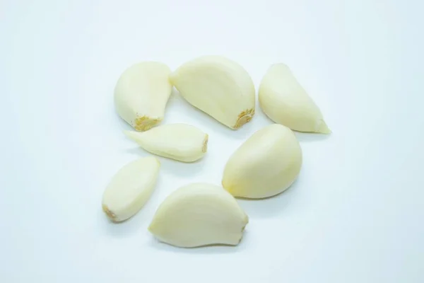 Peeled garlic located on a white background — Stok fotoğraf