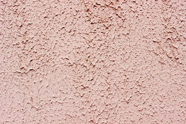 Wet decorative plaster orange plaster background texture