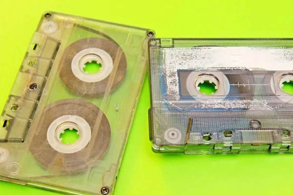 audio cassettes spread on a green background
