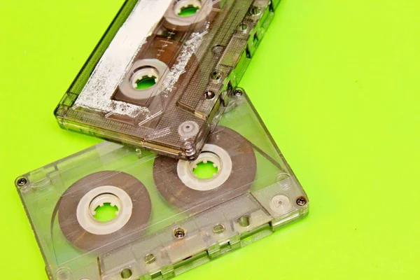 audio cassettes spread on a green background