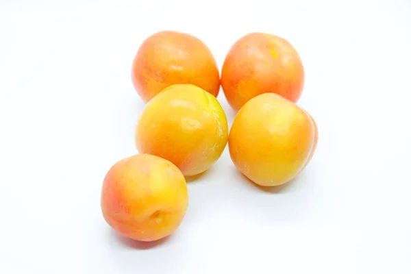 Inculate ripe plums located on a white background — Stock Photo, Image