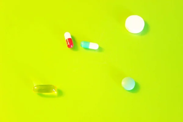 Pills Vitamins Medicines Located Green Background — Stock Photo, Image