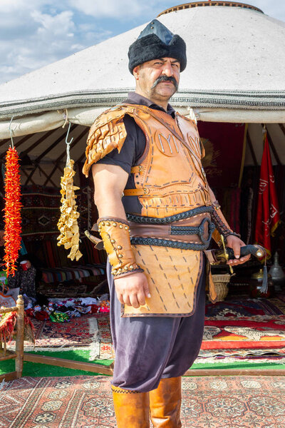 Istanbul / Turkey - October 04 2019: 4. Etnospor cultural festival. Old Ottoman - Turkish soldier poses on festival field with traditional clothes