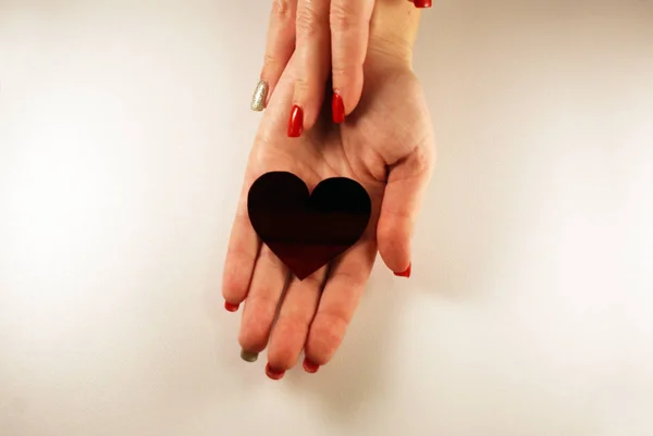 Heart in female hands, love, healthy heart.