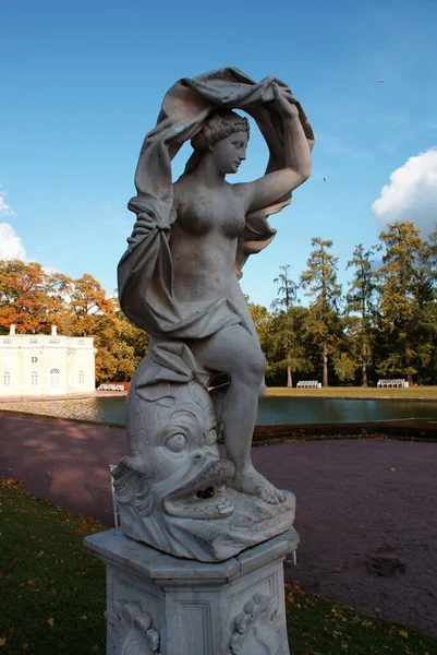 Historical sculptures in the park in the fall. St. Petersburg.