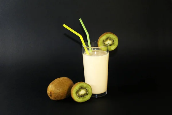 Juicy kiwi and healthy drink with a straw