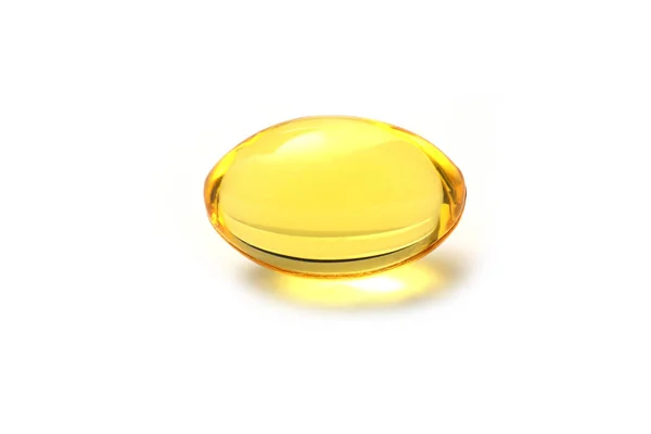 Suplementos de óleo de cor dourada em cápsula de gel macio — Fotografia de Stock