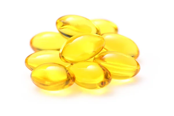 Gouden kleur olie supplementen in zachte gelcapsule — Stockfoto