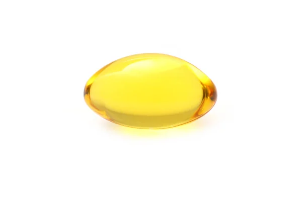 Golden color oil supplements in soft gel capsule — Stock Photo, Image