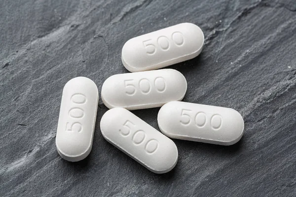 Medicines on black color stone — Stock Photo, Image