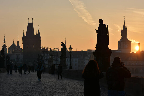 Dawn on the Charles Bridge in Prague. Morning in the Czech capital.