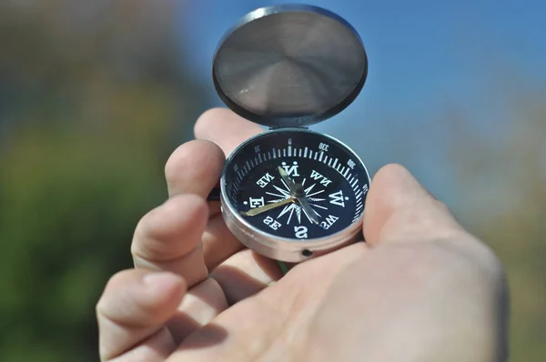 Compass in the palm of your hand. — Stock Photo, Image