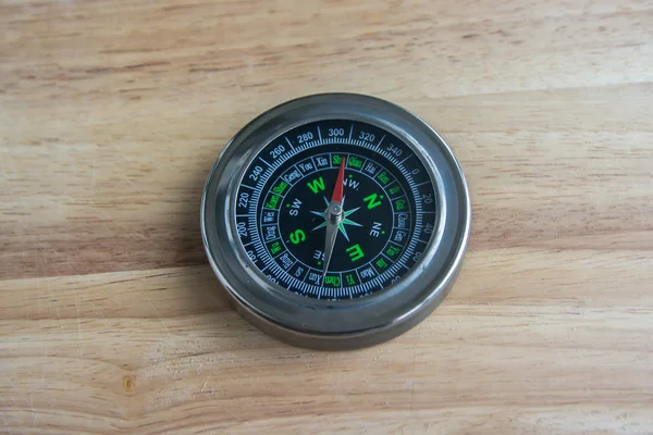 Compass on a wooden surface. — Stock Photo, Image