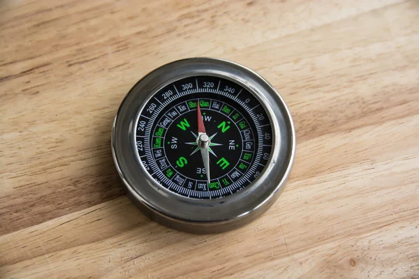 Compass on a wooden surface. — Stock Photo, Image