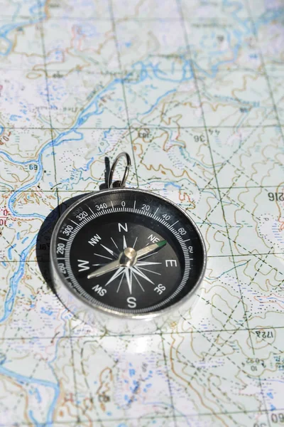 Magnetic compass and map. — Stockfoto