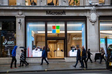 LONDON, UK - FEBRUARY 17, 2020: Pedestrians passing by Microsoft store on Regent Street, near Oxford Circus.