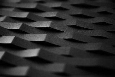 Siyah katlanmış kağıttan yapılmış soyut eğri çizgileri kusursuz mimari desen. Geometrik minimalist yüksek teknoloji dokusu yakın çekim.