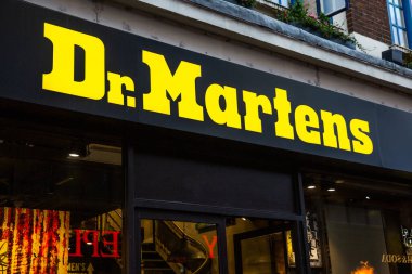 LONDON, UK - FEBRUARY 17, 2020: Closeup logo on exterior of Dr. Martens store on Oxford Street. Dr.Martens is a german brand of footwear.