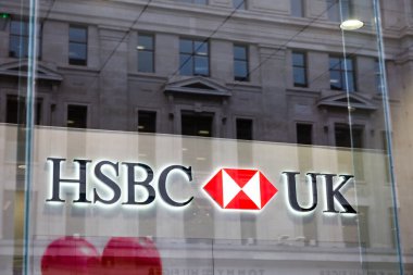 LONDON, UK - FEBRUARY 17, 2020: HSBC bank logo on facade of branch on Oxford street. HSBC Bank plc is one of the largest banking and financial services organisations in the world. 