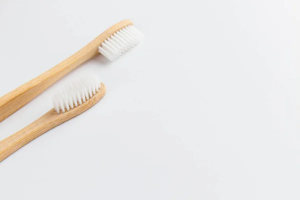 Two Bamboo Toothbrushes Plain White Background Isolated Empty Space Room — Stock Photo, Image