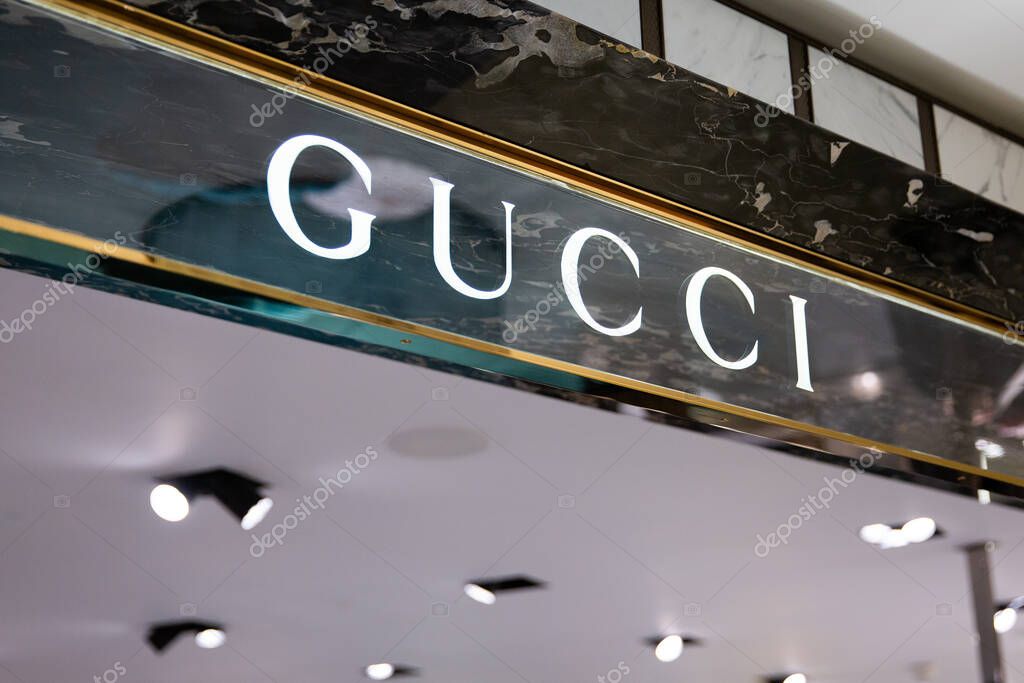 LONDON, UK - FEBRUARY 20, 2020: Gucci logo in Harrods shopping mall. Gucci is an Italian luxury brand of fashion and leather goods.
