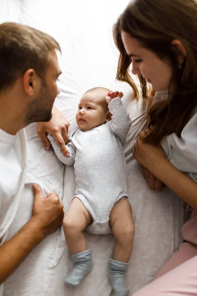 Young Happy Parents Lying Bed Playing Looking Cute Little Baby — Stock Photo, Image