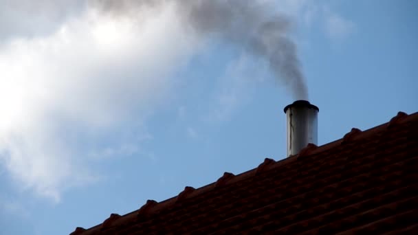 Smoking chimney on roof — Stock Video