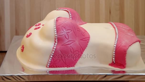 Cake in the shape of torso of woman's body — Stock Video