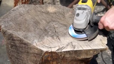 Working of walnut wood with angle grinder