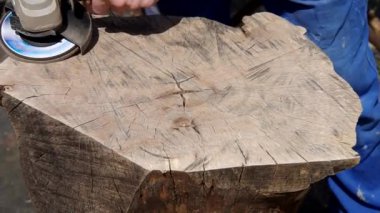 Working of walnut wood with angle grinder