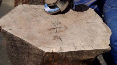 Working of walnut wood with angle grinder