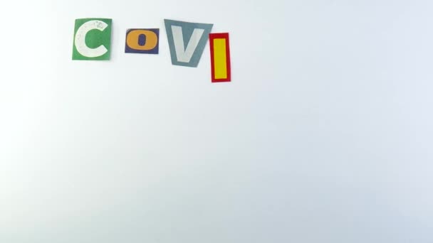 Zusammensetzung Des Wortes Covid Coronavirus Mit Papierbuchstaben — Stockvideo