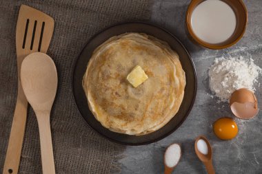 A stack of pancakes on the table for Maslenitsa. Pancake ingredients, Pancake recipe.
